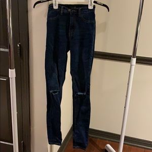 Ripped knee dark wash jeans